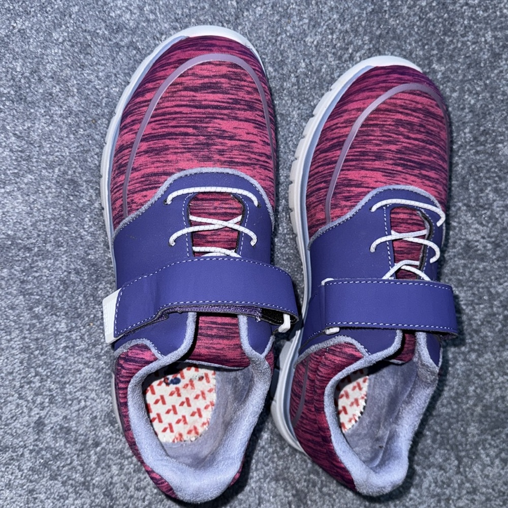 Woman’s Pink and Purple Shoes
